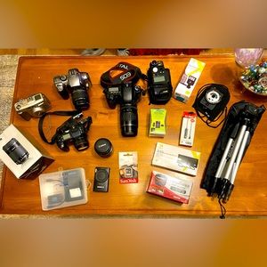 Several Canon cameras and accessories as a bundle